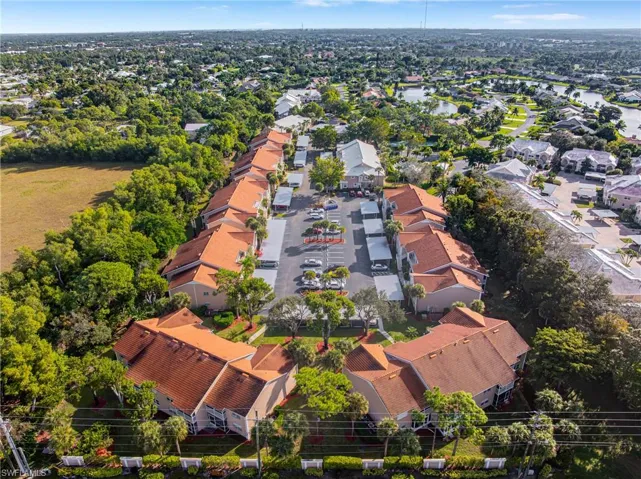Aerial view of residential area featuring a large body of water
