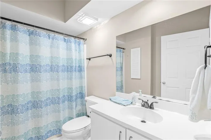 Full bath featuring vanity and a shower with curtain