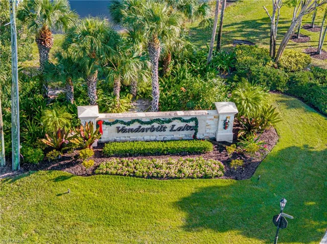 Community / neighborhood sign with a lawn