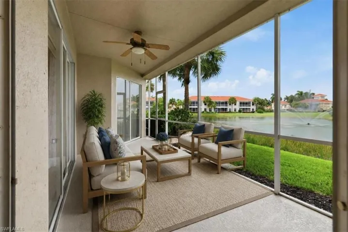 Virtually staged Screened patio featuring a ceiling fan, concrete flooring, sliding glass doors, and a water feature with fountain. Virtually staged