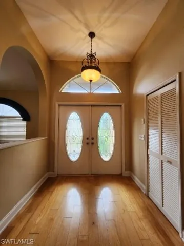 Entrance foyer featuring light wood-style flooring and baseboards