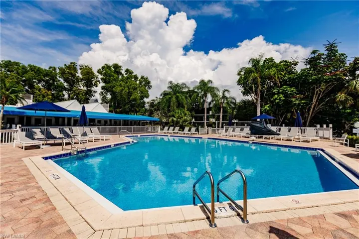 Pool featuring a patio area and fence