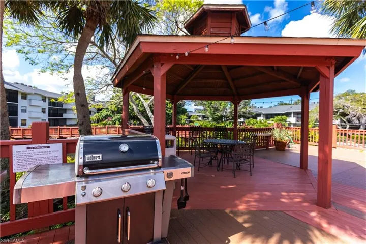 Wooden terrace featuring a gazebo