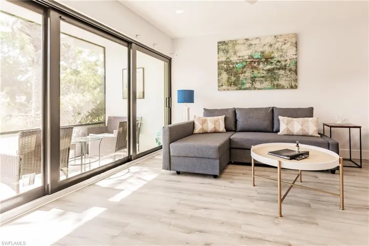 Living area featuring baseboards and light wood finished floors