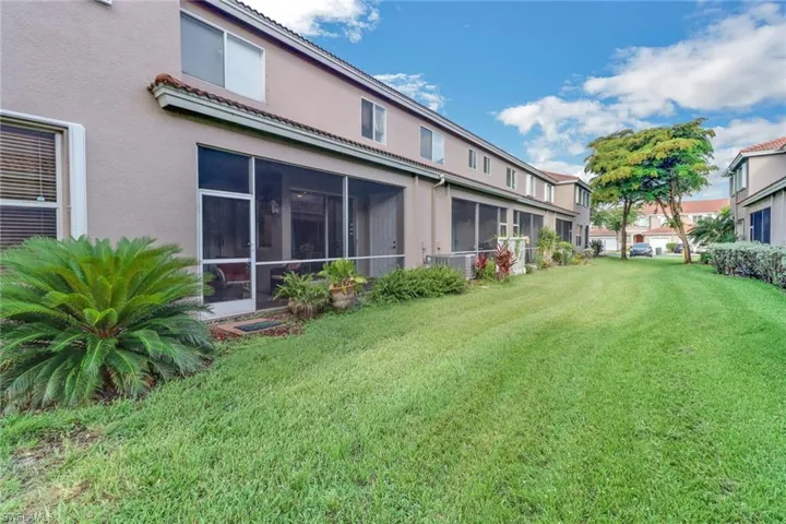 View of yard featuring a sunroom