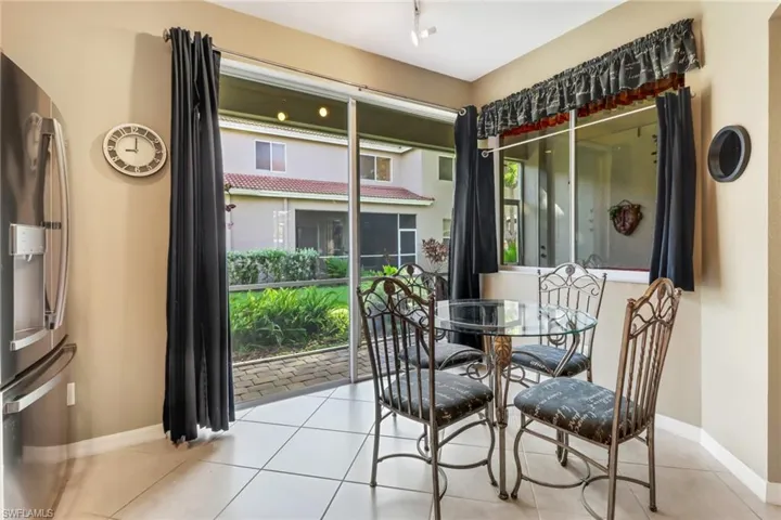 Dining space with light tile floors