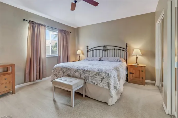 Bedroom with carpet and ceiling fan