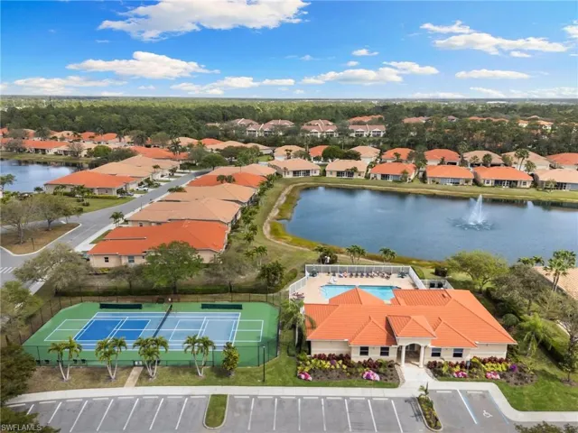 Aerial perspective of suburban area with a large body of water