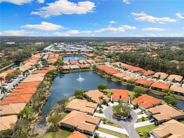 Aerial perspective of suburban area with a nearby body of water