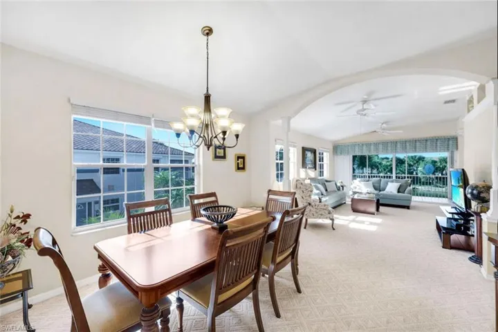 (Virtual wall color change) Formal dining area with large dining table perfect for gathering with family and friends.