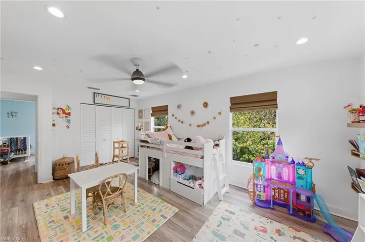 Bedroom featuring light wood-type flooring and a ceiling fan