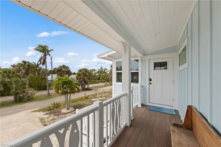 View of exterior entry with covered porch