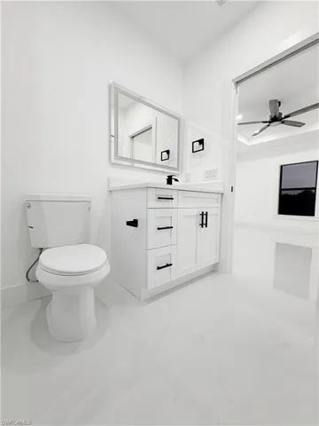 Bathroom featuring vanity and ceiling fan