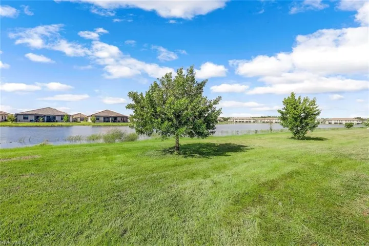 View of yard with a water view