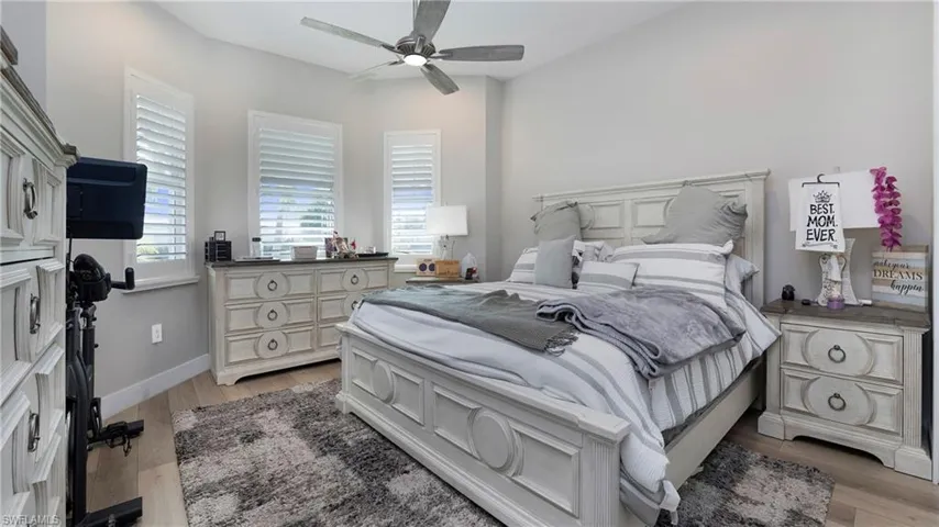 Bedroom featuring light wood-style flooring and a ceiling fan