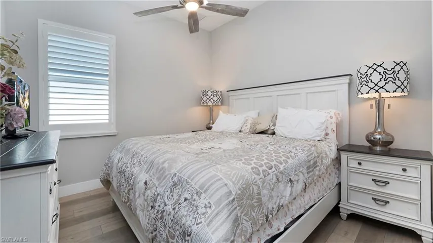 Bedroom featuring light wood-type flooring and ceiling fan