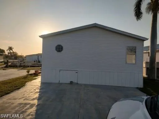 View of property exterior at dusk