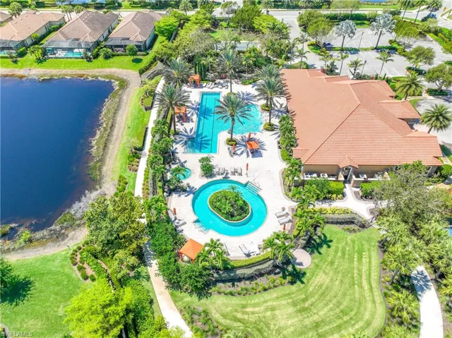 Bird's eye view of a pool area and a large body of water
