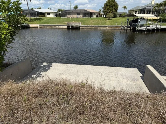 Dock featuring a residential view and a water view