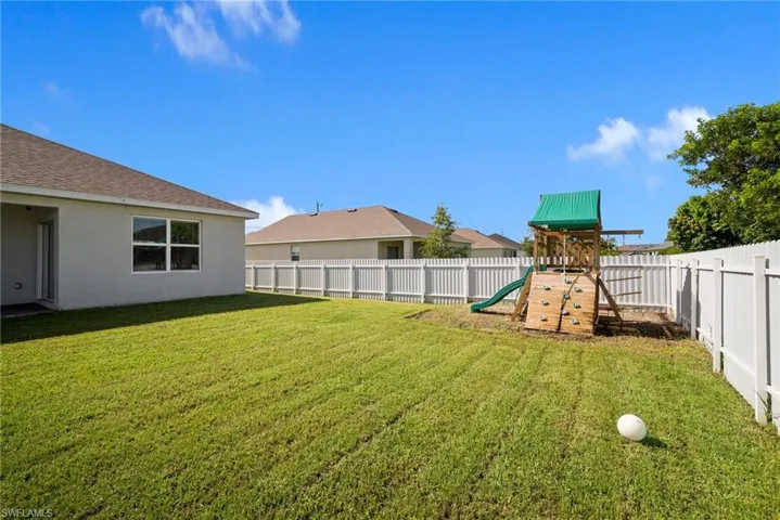View of yard with a playground