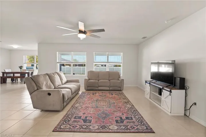 Tiled living room with ceiling fan