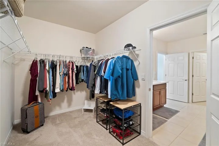 Spacious closet featuring light tile patterned floors