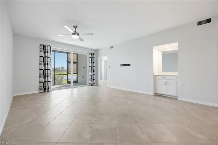 Welcoming great room with coffee bar & tile floors throughout