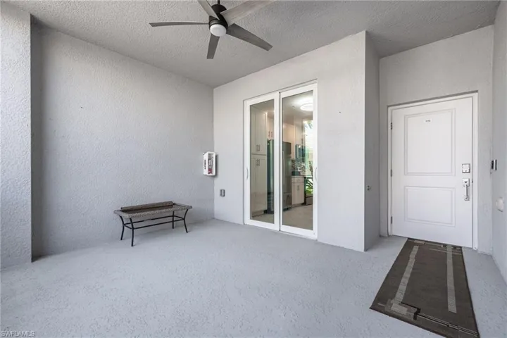 Spacious screened lanai with sliders to the kitchen in the front of the condo