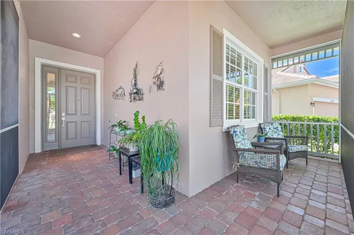 Property entrance with covered porch