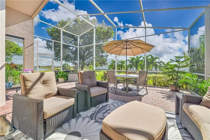 View of patio featuring screen enclosure