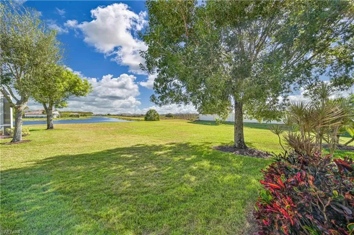 View of yard with a water view