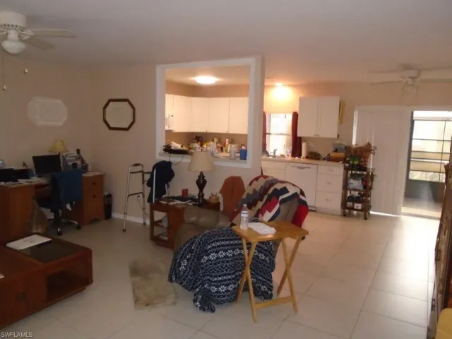 Living area featuring a ceiling fan