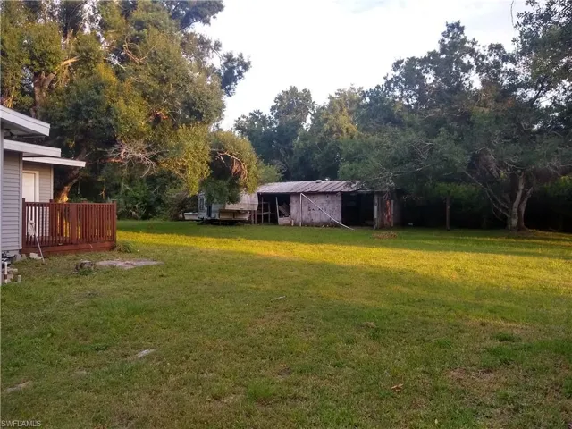 West side of grounds near home: barn in background