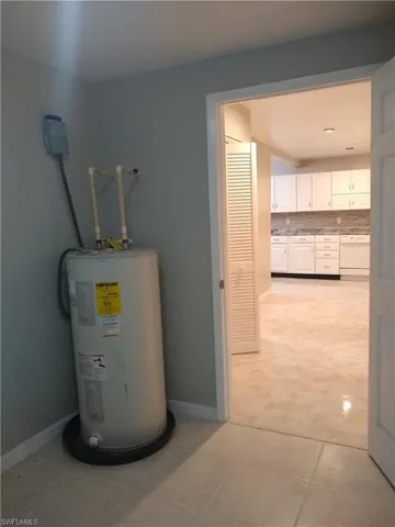 Utility / Laundry room with plenty of room for freezer. Direct access to house.