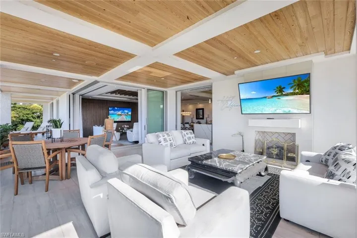 Open glass doors add this outdoor living to become almost 5000 sf of living in and out for gorgeous florida weather