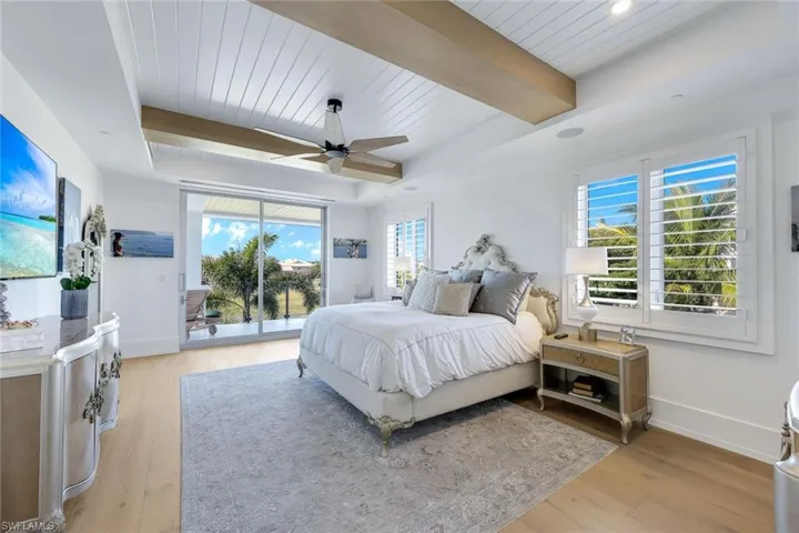 Primary Bedroom with Patio, 2 large closets and spa bath with sun wall