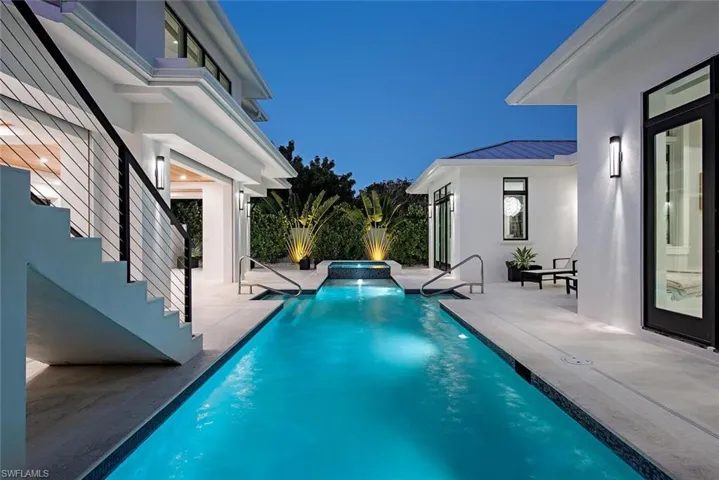 View of pool featuring an in ground hot tub and a patio area