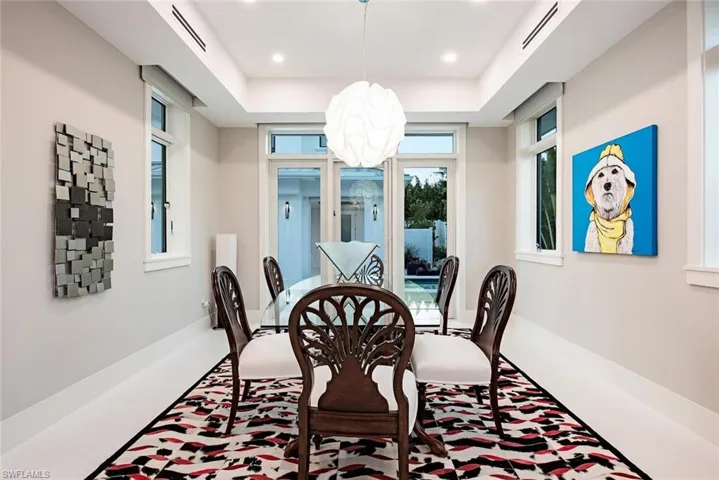 Dining area with a raised ceiling