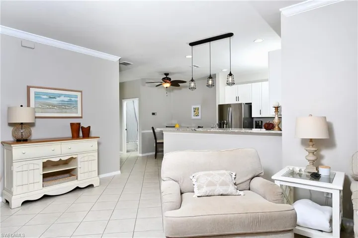 looking towards kitchen, guest bath and bed and garage