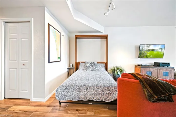 Murphy bed tucked in the living room for short term guests or grandkids.