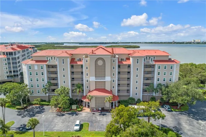 View of property with a water view