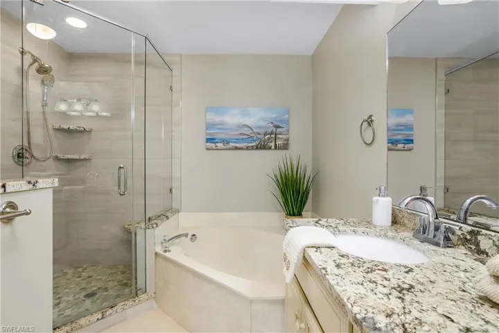 Tiled bedroom featuring ceiling fan