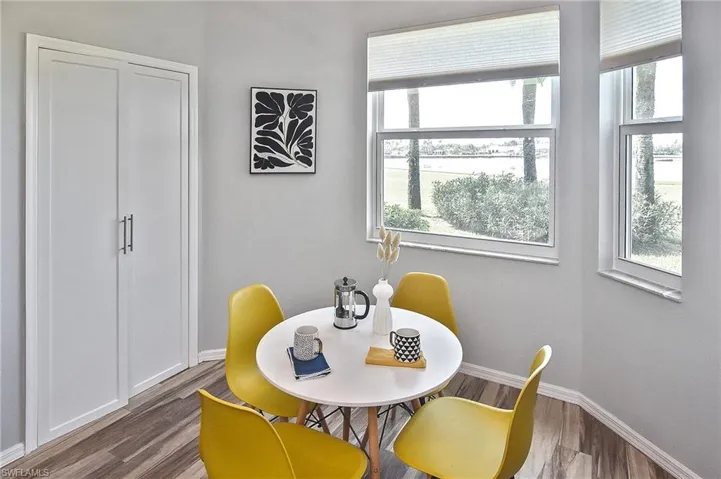 Dining room with baseboards and dark wood finished floors