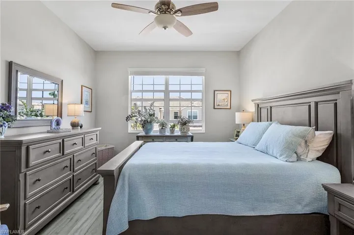 Bedroom featuring a ceiling fan and light wood-style floors