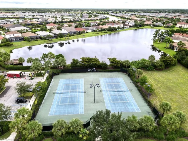 Drone / aerial view featuring a water view and a residential view