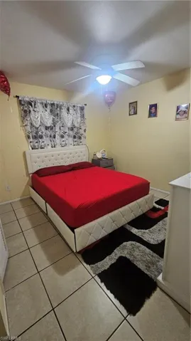 Bedroom featuring ceiling fan and light tile patterned floors