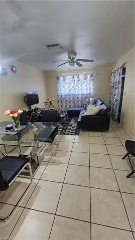Tiled living room with ceiling fan
