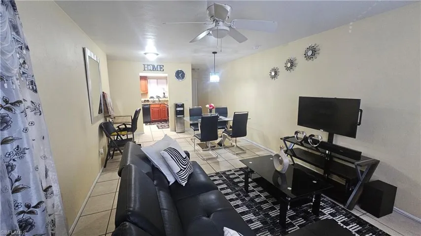 Tiled living room with ceiling fan
