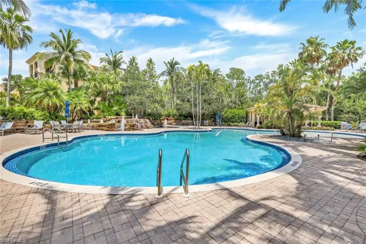 Community pool featuring a patio