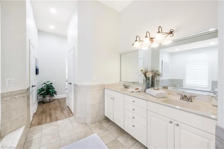 Primary bathroom with large double vanity.